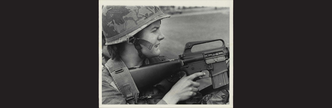 PFC Karen Ledding concentrating before firing from standing position, 1984
